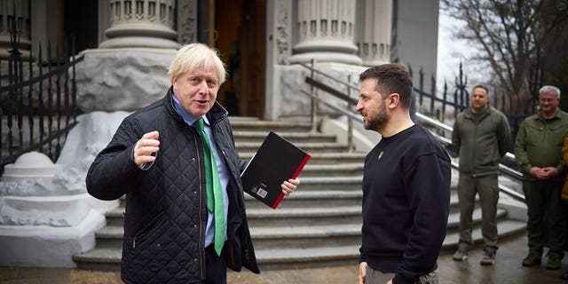 In this photo provided by the Ukrainian Presidential Press Office, Ukrainian President Volodymyr Zelenskyy, right, and former British Prime Minister Boris Johnson talk during their meeting in Kyiv, Ukraine, Sunday, Jan. 22, 2023. 