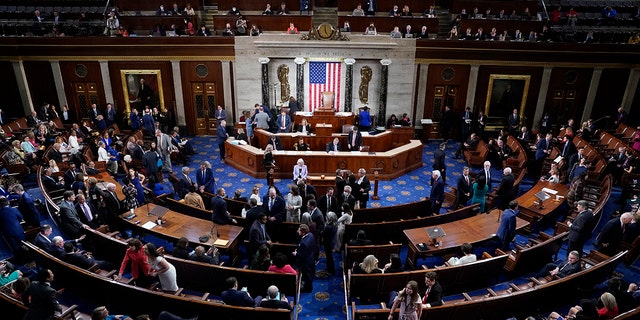 Members talk on the floor of the House Chamber on the opening day of the 118th Congress on Tuesday, January 3, 2023, at the U.S. Capitol in Washington DC. 