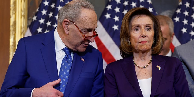 House Speaker Nancy Pelosi, D-Calif., speaks with Senate Majority Leader Chuck Schumer, D-NY, at the U.S. Capitol Building on December 08, 2022 in Washington, DC. 