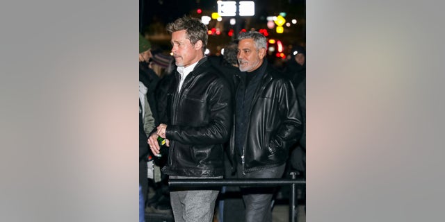Pitt, 59, and Clooney, 61, were having a twinning moment, both sporting leather jackets and gray pants with black shoes.