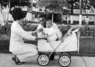 Pelé and his wife, Rosemeri, take their young daughter, Kely, out for a walk in 1967. It was their first child together. They would have three children in all before divorcing in 1978.