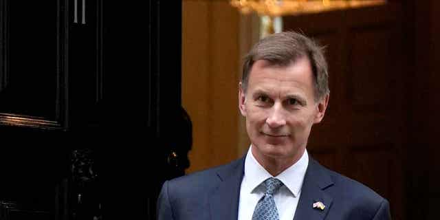 Britain's Chancellor Jeremy Hunt is shown on his way to attend Parliament in London, on Nov. 17, 2022. Hunt said on Jan. 27, 2023, that taming inflation is more important than cutting taxes.
