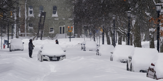 An abandoned car rests on a street in the Elmwood Village neighborhood of Buffalo, New York, on Monday.