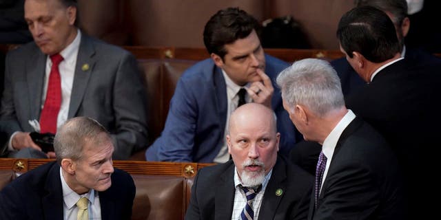 Kevin McCarthy, R-Calif., speaks with Reps. Jim Jordan, R-Ohio, and Chip Roy, R-Texas, on the House floor on the second day of voting for House speaker. 