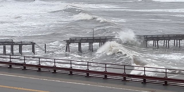 Capitola Wharf damaged by heavy storm waves is seen in Santa Cruz, California, U.S., January 5, 2023, in this screen grab obtained from a social media video. (Kelly Pound/via REUTERS)