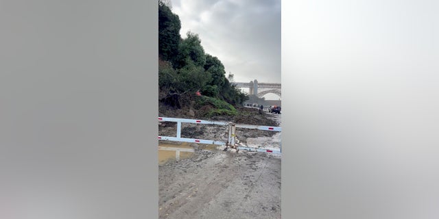 Mudslide covers part of a road near Golden Gate bridge following storms in San Francisco, California, U.S. January 5, 2023, in this screen grab obtained from social media video. (Taylor Gilland/via REUTERS)