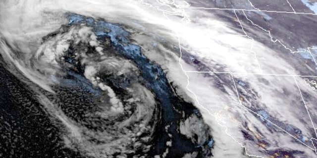 This GOES-West GeoColor satellite image made available by NOAA shows a storm system approaching along U.S. West coast at 9:16 p.m. EST, on Wednesday, Jan. 4, 2023. As a huge storm approached California on Wednesday, officials began ordering evacuations in a high-risk coastal area where mudslides killed 23 people in 2018, while residents elsewhere in the state scrambled to find sandbags, and braced themselves for flooding and power outages. 