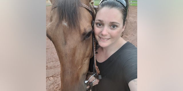 Allison Holthoff with her horse, from which she fell in September 2022, resulting in months of chronic pain that only grew worse with time.