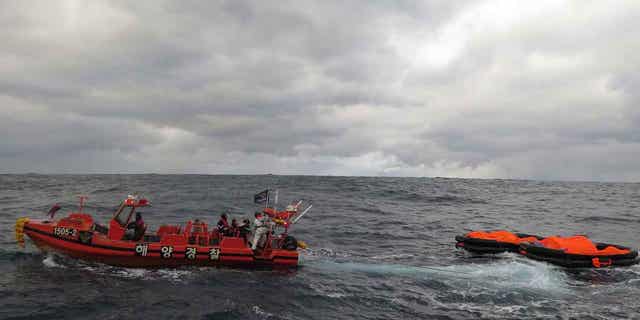 A South Korean coast guard vessel conducts a search operation in waters between South Korea and Japan on Jan. 25, 2023. The two country's coast guards were searching for crew members of a cargo ship that sank in waters between South Korea and Japan.