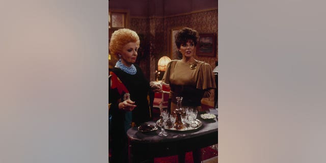 Carole Cook and Joan Collins star on an episode of "Dynasty" in 1987. 