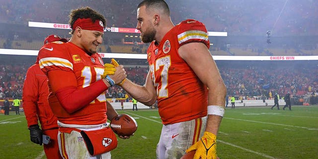 Kansas City Chiefs quarterback Patrick Mahomes, left, and tight end Travis Kelce celebrate a win over Jacksonville in the divisional round of the playoffs, Jan. 21, 2023, at Arrowhead Stadium in Kansas City, Missouri.