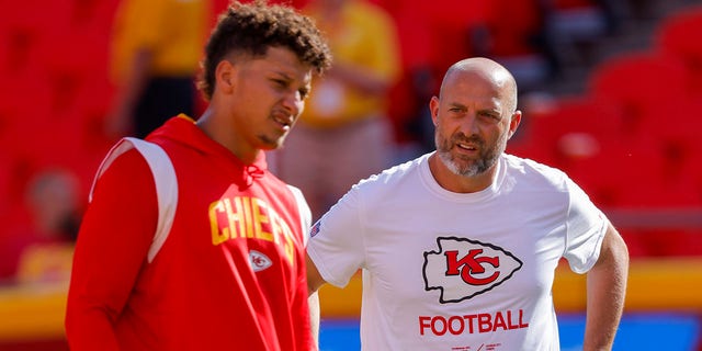 Kansas City Chiefs quarterbacks coach Matt Nagy, right, speaks to Patrick Mahomes prior to the preseason game against the Green Bay Packers on Aug. 25, 2022, in Kansas City, Missouri.