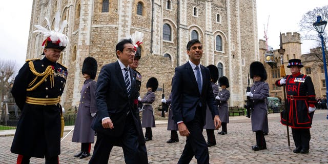 Prime Ministers Rishi Sunak and Fumio Kishida arrive at the Tower of London, Wednesday, Jan. 11, 2023.