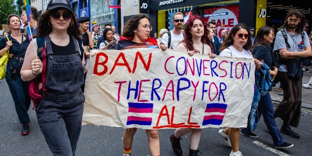 LGBT campaigners join Gay Liberation Front veterans marking the 50th anniversary of the first U.K. Pride march in 1972 on July 1, 2022, in London.