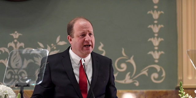 Gov. Jared Polis delivers his state of the state address at the Colorado State Capitol Building. (AAron Ontiveroz/MediaNews Group/The Denver Post via Getty Images)
