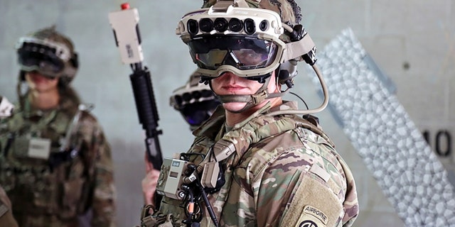 Soldiers wear a prototype of the U.S. Army's Integrated Visual Augmentation System and wield a Squad immersive Virtual Trainer during a training environment test event at its third Soldier Touchpoint at Fort Pickett, Va., Oct. 21, 2020.