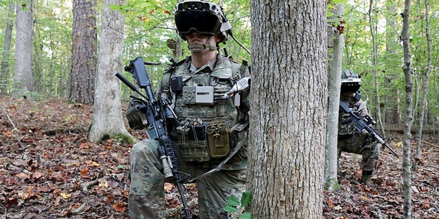 Soldiers wear a prototype of the U.S. Army's Integrated Visual Augmentation System during a Soldier Touchpoint 3 squad reconnaissance mission test training event at Fort Pickett, Va., Oct. 21, 2020. 