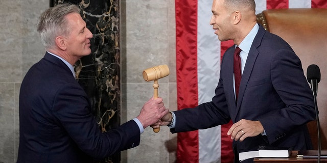 Incoming House Speaker Kevin McCarthy of Calif., receives the gavel from House Minority Leader Hakeem Jeffries of N.Y., on the House floor at the U.S. Capitol in Washington, early Saturday, Jan. 7, 2023. 