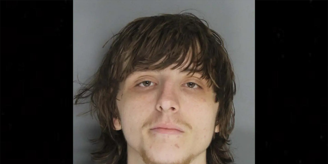 Mugshot of Jackson Rutland, who stole his ex-girlfriend mother's ashes to pawn for heroin money.