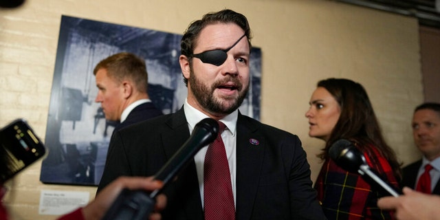 Rep. Dan Crenshaw, R-Texas, speaks to media on Capitol Hill on the opening day of the 118th Congress at the U.S. Capitol in Washington, Tuesday, Jan 3, 2023.