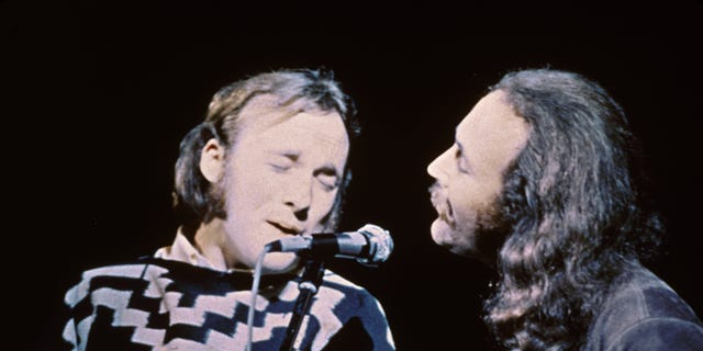 Stephen Stills (left) and David Crosby of the group Crosby, Stills &amp; Nash performing on stage at the Woodstock Music and Art Festival in 1969.