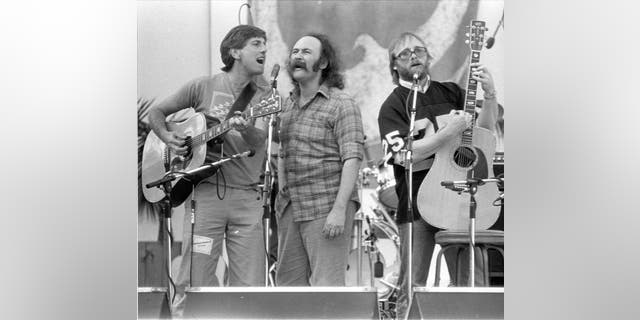 Graham Nash, David Crosby and Stephen Stills of the group Crosby, Stills &amp; Nash performing in 1980.