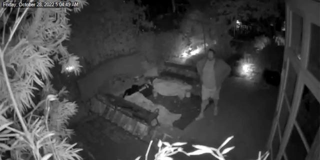 The footage shows DePape scoping out the glass door he allegedly broke to get into the home before disappearing and coming back with two bags, pulling an object out of the smaller bag and moving it into the larger bag.