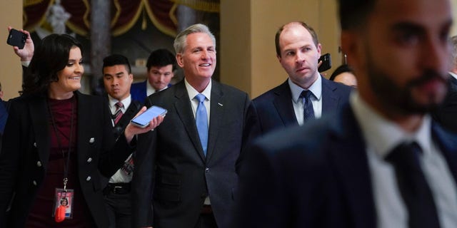 House Speaker Kevin McCarthy of Calif., speaks with members of the press as he walks to the House floor on Capitol Hill in Washington, Wednesday, Jan. 11, 2023.