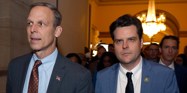 WASHINGTON, DC - JANUARY 04: U.S. Rep.-elect Scott Perry, R-Penn., left, and Rep.-elect Matt Gaetz, R-Fla., right, leave the House Chamber at the U.S. Capitol Building on January 04, 2023, in Washington, DC. 