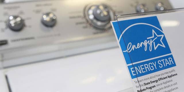 A washing machine rated as energy efficient is pictured.