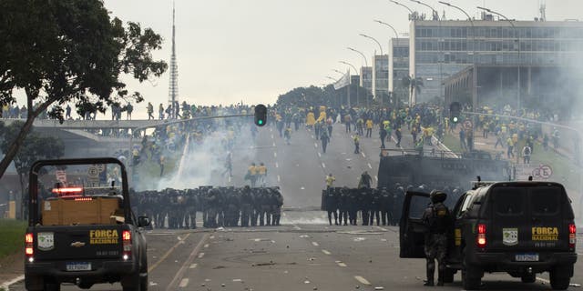 Supporters of former President Jair Bolsonaro clash with security forces as they raid the National Congress in Brasilia, Brazil, 08 January 2023. ( Joedson Alves/Anadolu Agency via Getty Images)