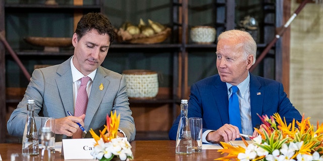 President Joe Biden looks to Canadian Prime Minister Justin Trudeau during a meeting of G7 and NATO leaders in Bali, Indonesia, Nov. 16, 2022. 
