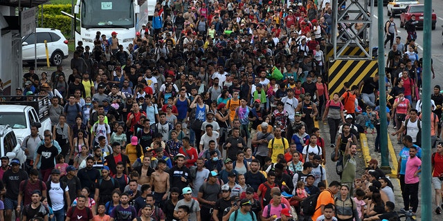 Latin American migrants take part in a caravan towards the border with the United States, in Huehuetan, Chiapas state, Mexico, on June 7, 2022.