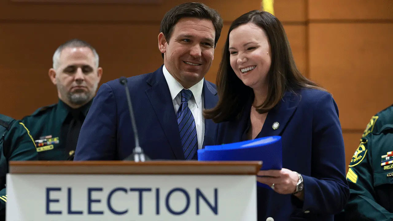 Florida Gov. Ron DeSantis and Attorney General Ashley Moody at a news conference. 