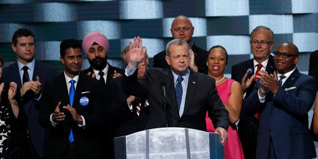 Retired U.S. Marine General John Allen (C) is applauded while addressing the final night of the Democratic National Convention in Philadelphia, Pennsylvania, U.S. July 28, 2016. REUTERS/Mike Segar