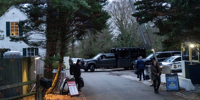 FILE - The access road to President Joe Biden's home in Wilmington, Del., is seen from the media van on Jan. 13, 2023. 