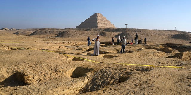 Egyptian antiquities workers dig at the site of the Step Pyramid of Djoser in Saqqara, Egypt, on Jan. 26, 2023.