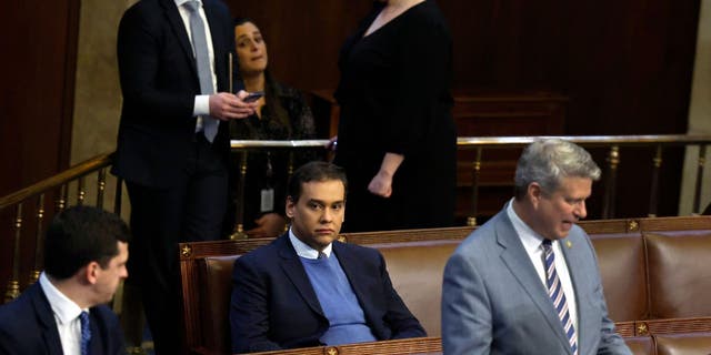 Rep.-elect George Santos sits by himself in the House chamber on the first day of voting for House speaker. 