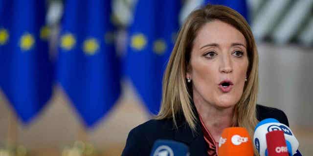 European Parliament President Roberta Metsola speaks with the media at an EU summit in Brussels on Dec. 15, 2022. Metsola, on Jan. 2, 2023, launched an urgent procedure for the waiver of immunity of two lawmakers following an investigation that is looking into a political scandal within the European Union.