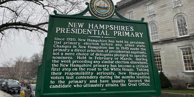 A sign marking New Hampshire's cherished century-old tradition of holding the nation's first presidential primary stands across the street from the state Capitol in Concord, N.H., Dec. 7, 2022.
