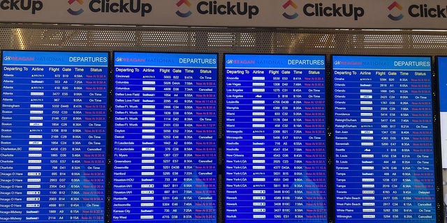 A message board shows departures at Ronald Reagan Washington National Airport in Arlington, Va., on Wednesday, Jan. 11. 2023. A computer outage at the Federal Aviation Administration brought flights to a standstill across the U.S. on Wednesday, with hundreds of delays quickly cascading through the system at airports nationwide. 