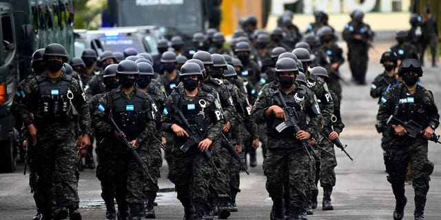Members of the Military Police of Public Order (PMOP) prepare to mobilize during a special operation in Honduras on Nov. 27, 2022. For environmental activists Honduras is considered extremely dangerous. 