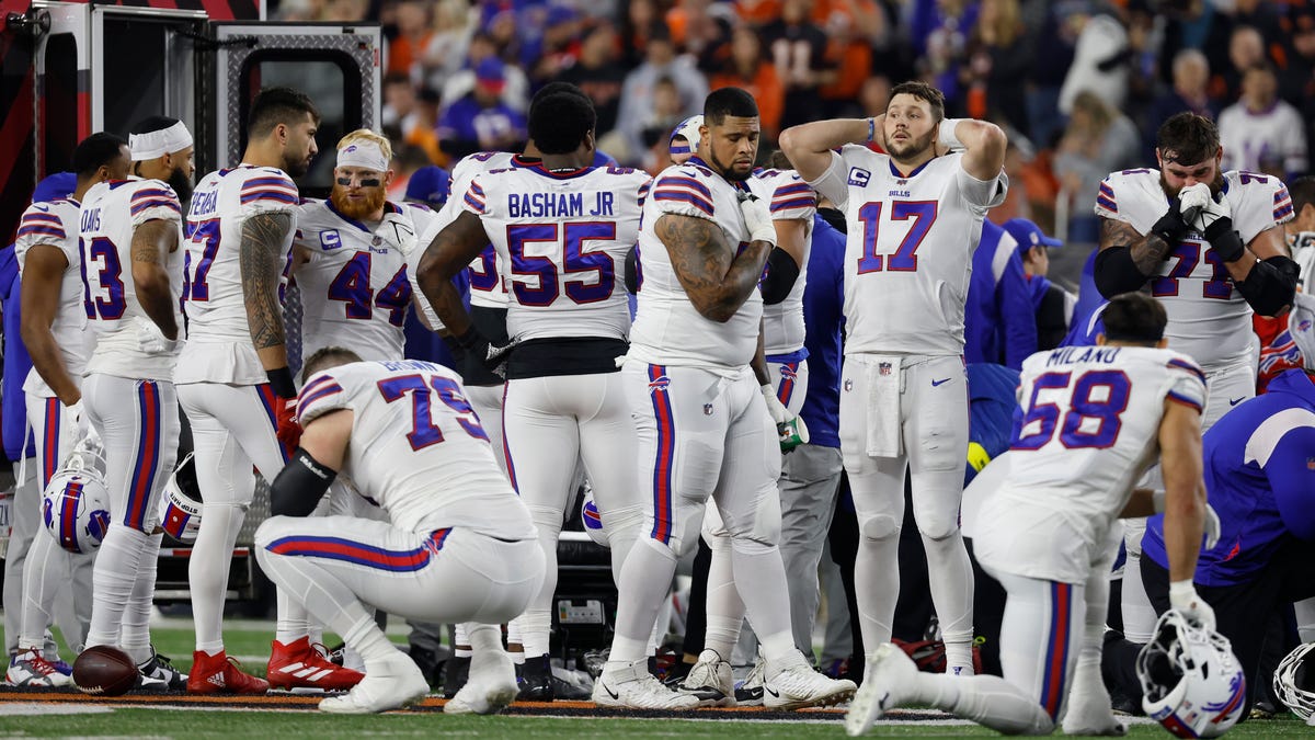 Bills players gather around Damar Hamlin.