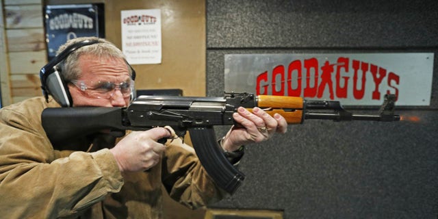 Vince Warner fires an AK-47 with a bump stock installed at Good Guys Gun and Range on Feb. 21, 2018, in Orem, Utah. The bump stock is a device when installed allows a semi-automatic to fire at a rapid rate much like a fully automatic gun. 