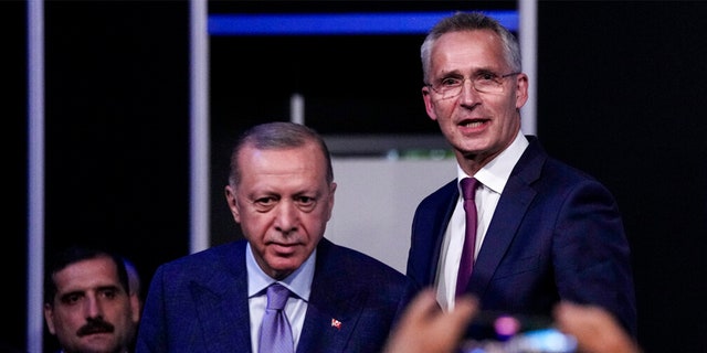 Turkish President Recep Tayyip Erdogan, second left, and NATO Secretary General Jens Stoltenberg before signing a memorandum in which Turkey agrees to Finland and Sweden's membership of the defense alliance in Madrid, Spain on Tuesday, June 28, 2022. 