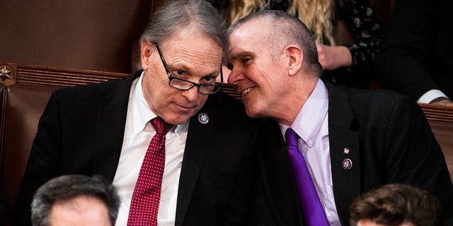 Rep.-elects Andy Biggs, R-Ariz., left, and Matt Rosendale, R-Mont., are seen on the House floor during a vote in which House Republican Leader Kevin McCarthy, R-Calif., did not receive enough votes to become Speaker of the House on Thursday, Jan. 5, 2023.