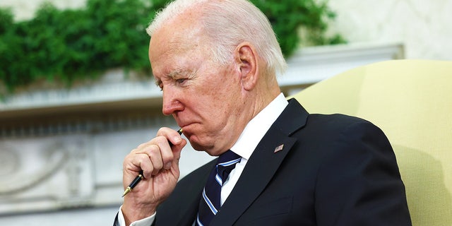 President Joe Biden is shown in the Oval Office at the White House on January 13, 2023.