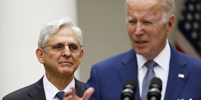 Attorney General Merrick Garland looks on as President Biden speaks during an event in the Rose Garden of the White House on May 13, 2022.