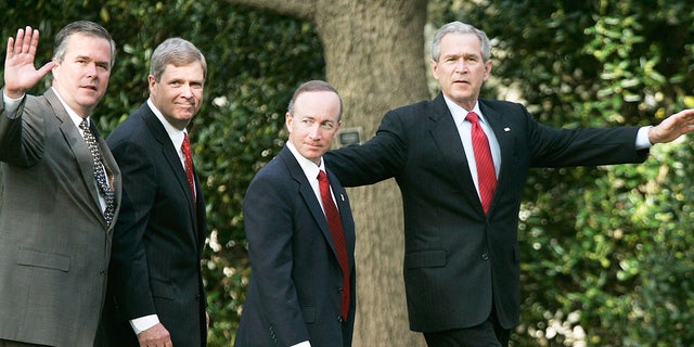 Former President George W. Bush, right, walks with governors after speaking to the press on the war on terror April 19, 2006 at the White House in Washington, D.C.