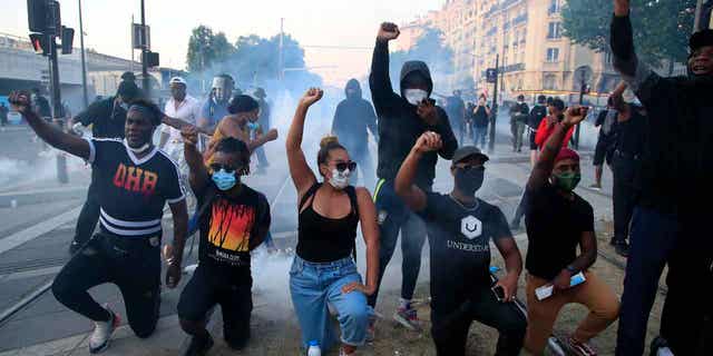 Protesters gesture during a demonstration against police racial injustice, on June 2, 2020, in Paris. French Prime Minister Elisabeth Borne announced a new plan on Jan. 30, 2023, to defeat racism, anti-Semitism, and discrimination of all kinds in the country. 